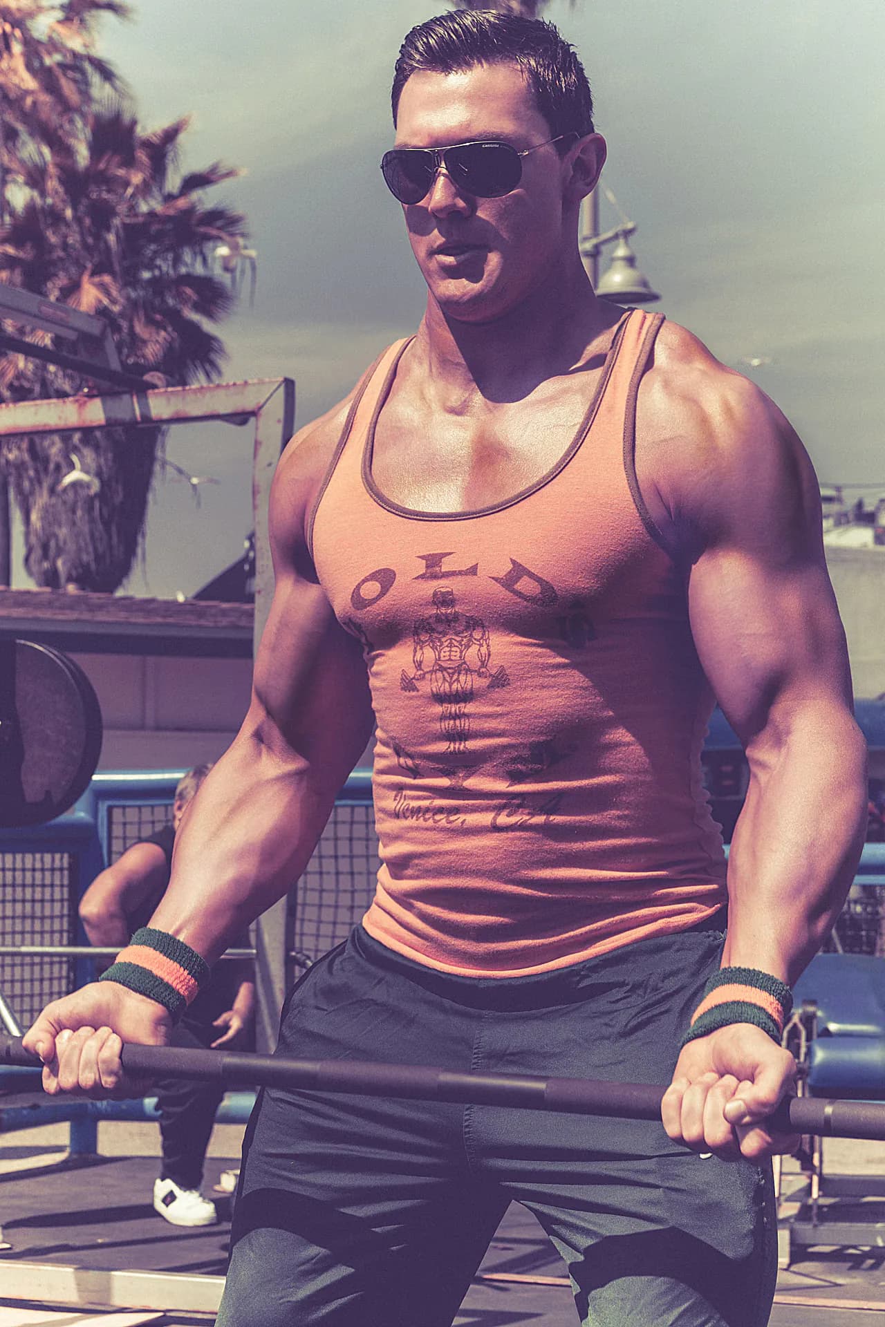 Matthew Scaglione with a barbell at Muscle Beach, Venice
